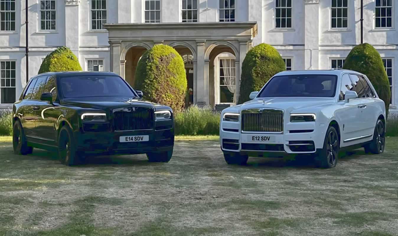 Black and white Rolls-Royce Cullinans side by side