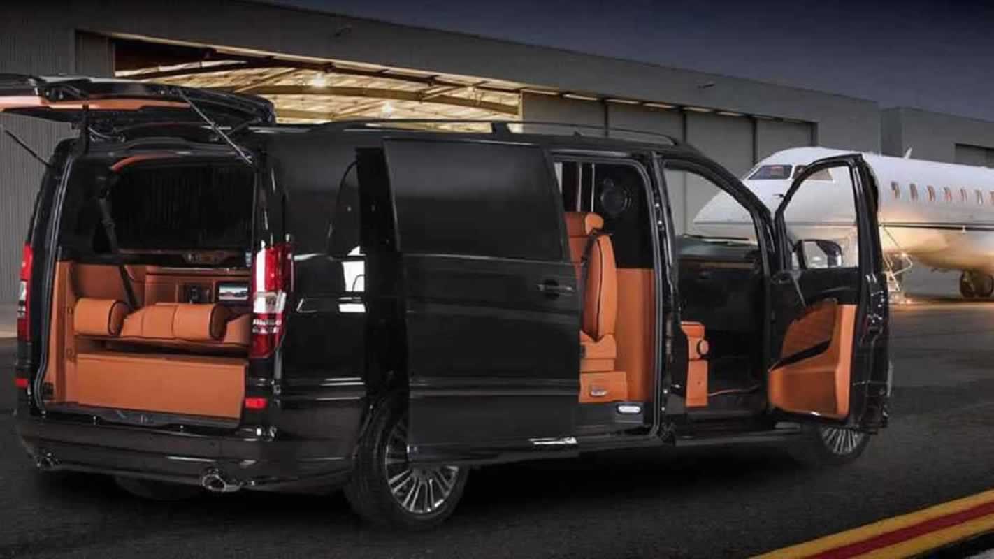 MPV beside aircraft during airport transfer service