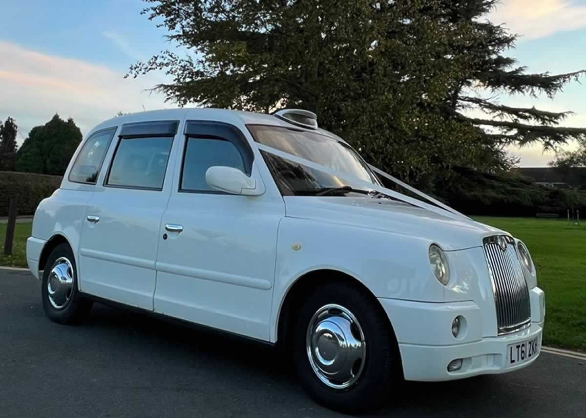 White London Tasxi TX4 with wedding ribbons