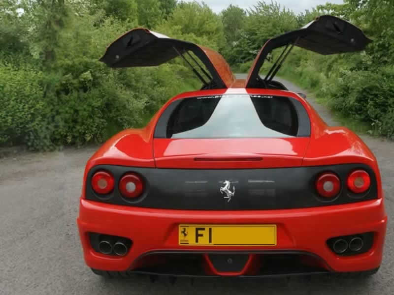 Ferrari stretch limo rear with gullwing doors open
