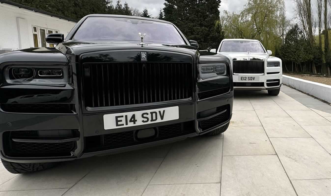 black adn white Rolls-Royce Cullinans - black in front