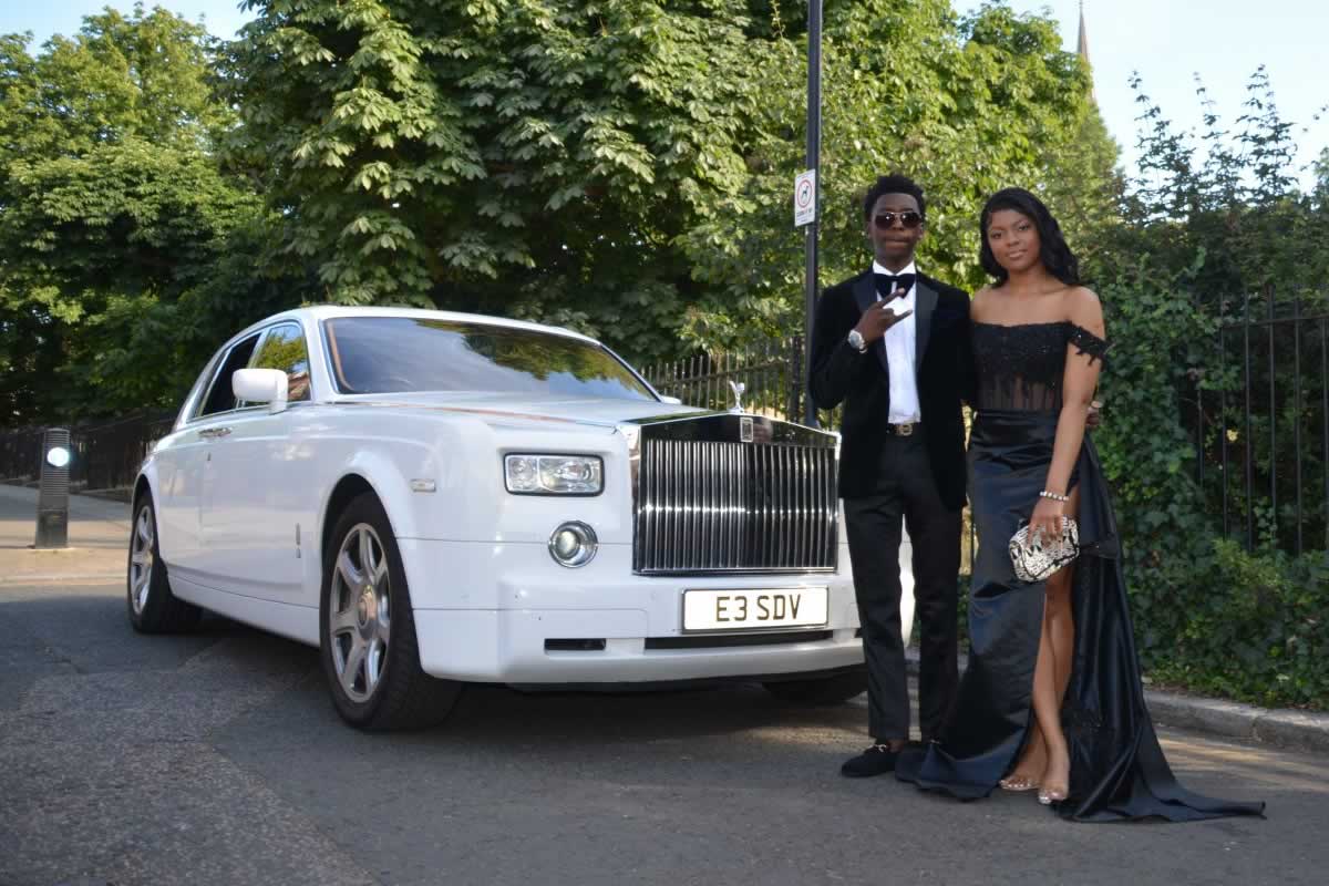 prom night couple with a Rolls Royce