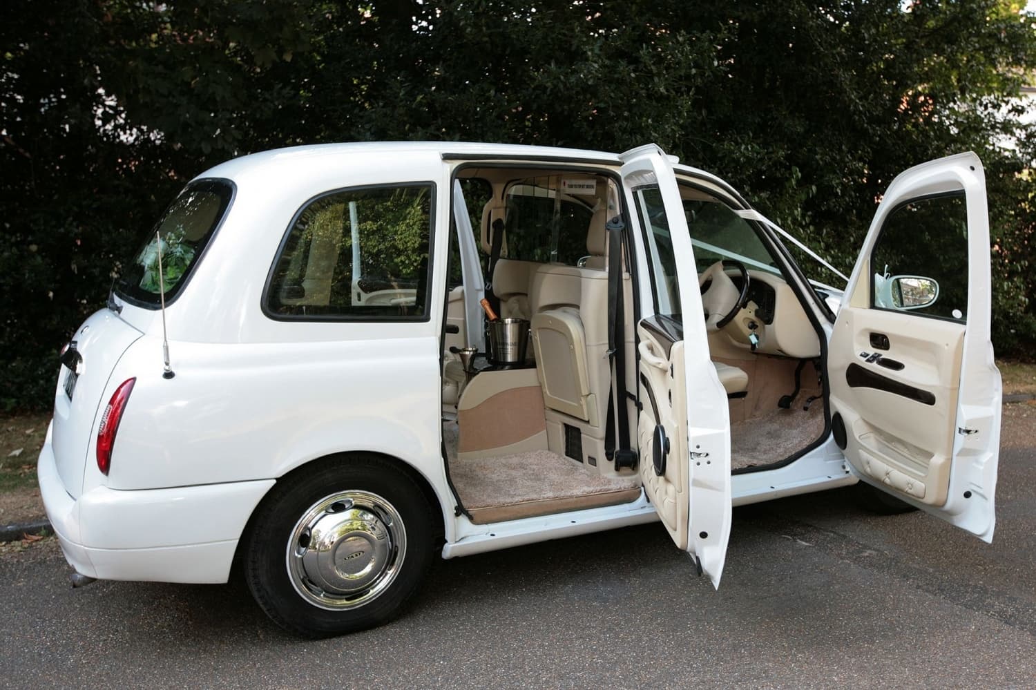 White London Taxi TX4 with doors oipen and view of interior